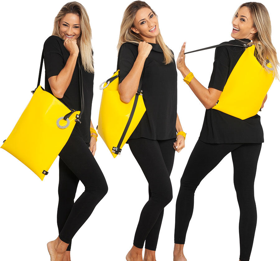 Borsa/Zaino LILLY in pelle riciclata giallo smile DAMPAÌ, indossata da modello Borsa a tracolla trasformabile in zaino LILLY in pelle RICICLATA colore giallo smile DAMPAÌ, indossata da modello
